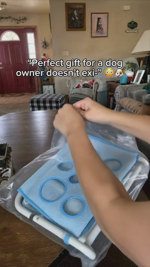 Dog being bathed in the GroomEase grooming hammock stand